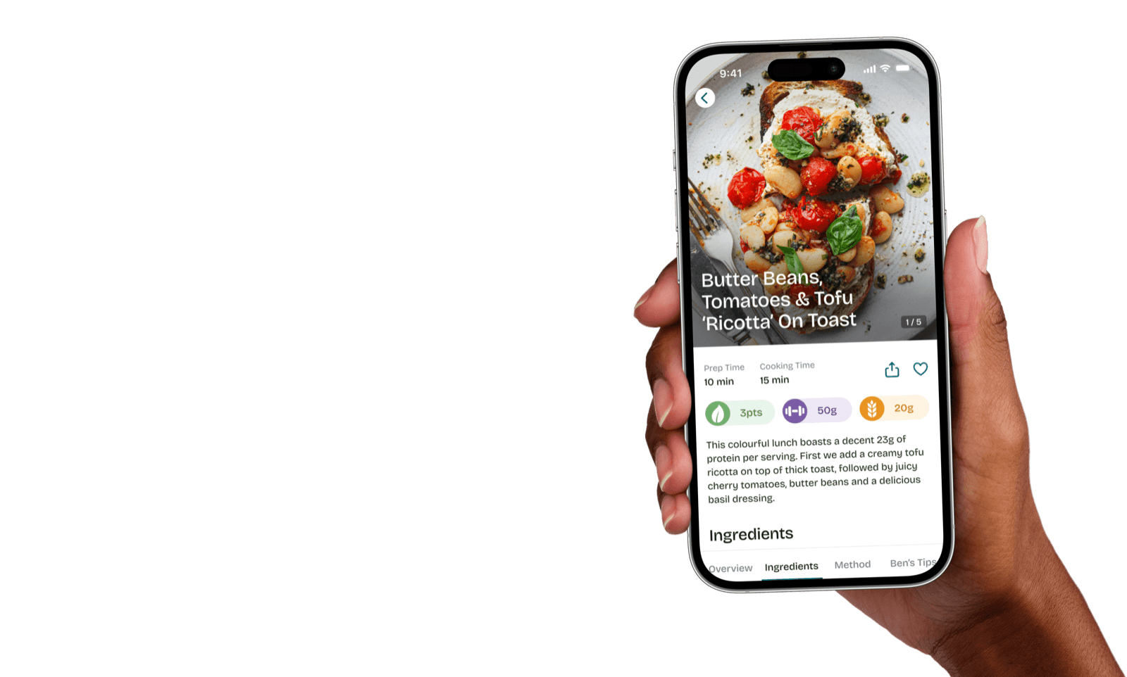 A hand holding a phone showing a SO VEGAN recipe in the app